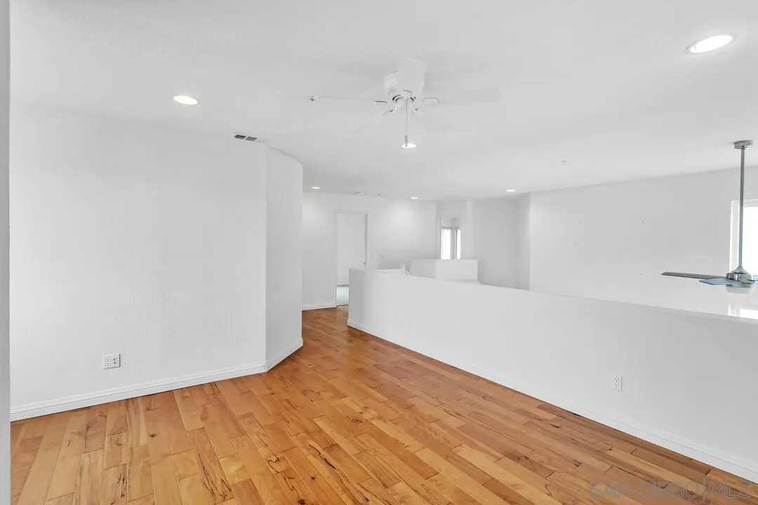 117 Willow Pond Road Santee, CA 92071 - Photo 29 of 49 a view of a big room with wooden floor and windows