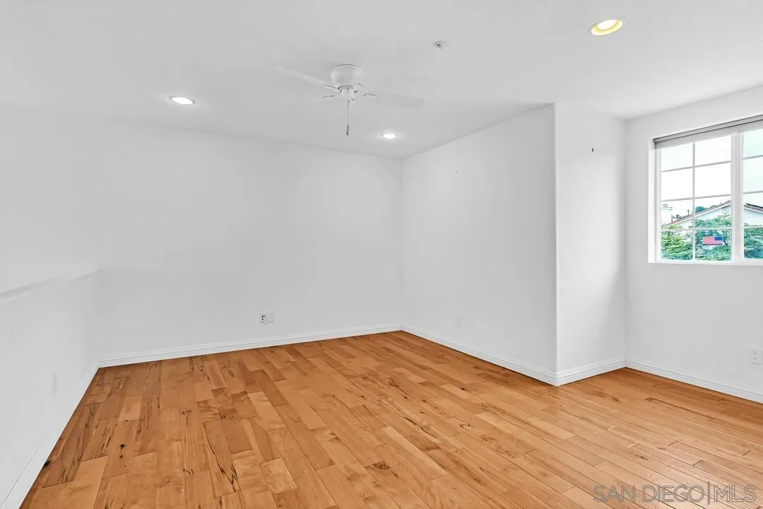 117 Willow Pond Road Santee, CA 92071 - Photo 31 of 49 a view of empty room with wooden floor and fan