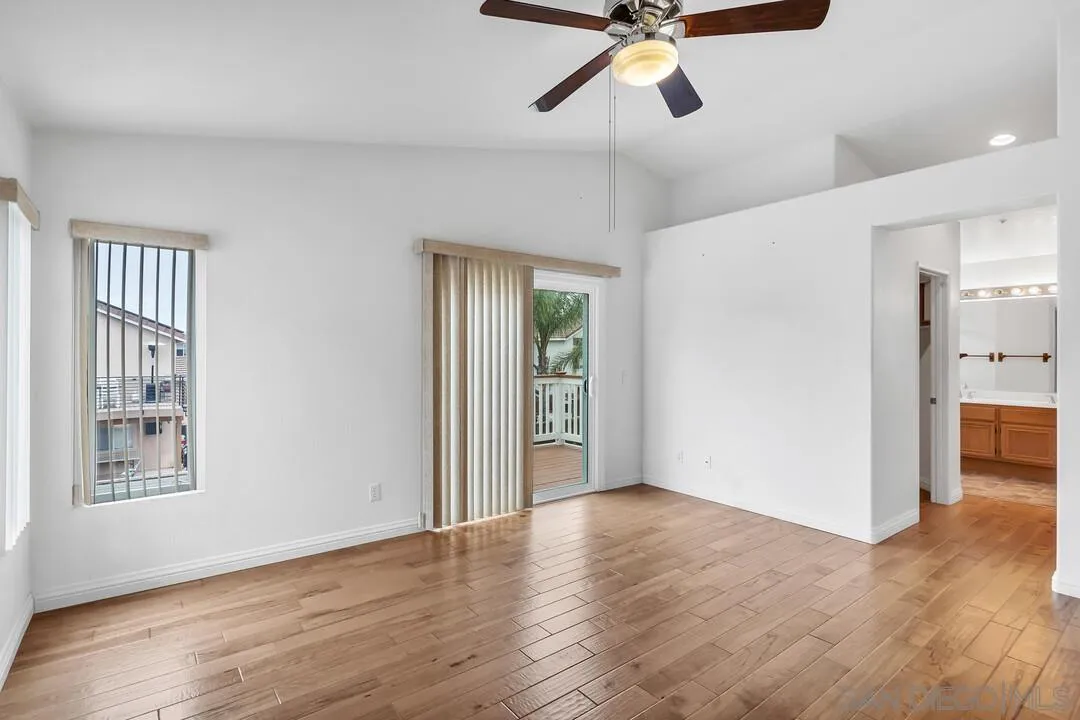 117 Willow Pond Road Santee, CA 92071 - Photo 33 of 49 a view of an empty room with wooden floor and a window