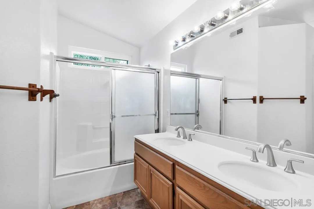 117 Willow Pond Road Santee, CA 92071 - Photo 38 of 49 a bathroom with a double vanity sink mirror and shower