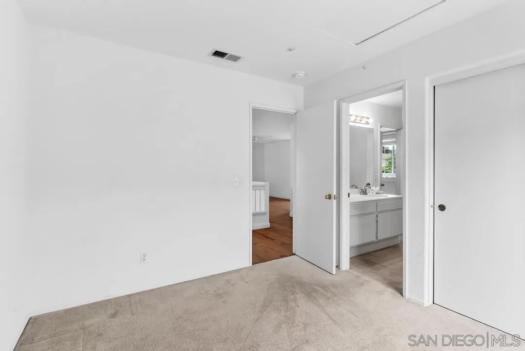 117 Willow Pond Road Santee, CA 92071 - Photo 43 of 49 a view of a hallway with wooden floor and cabinets