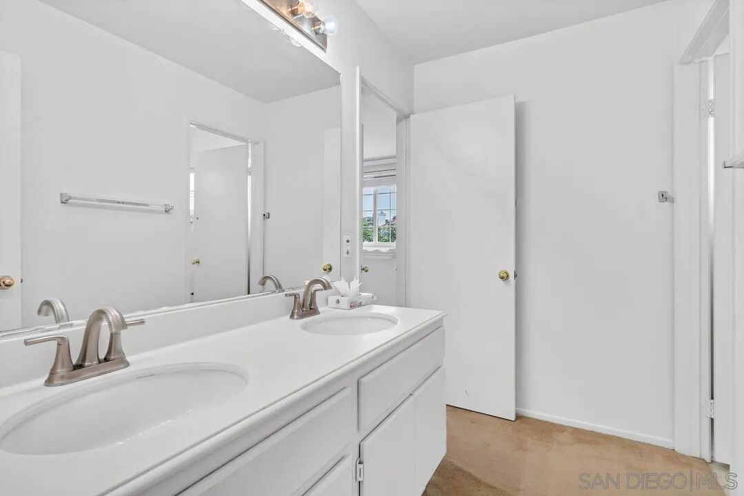 117 Willow Pond Road Santee, CA 92071 - Photo 44 of 49 a bathroom with a sink and a mirror