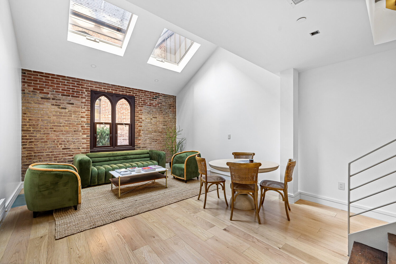 232 Adelphi Street, Unit 4 Brooklyn, NY 11205 - Photo 1 of 15 a living room with furniture and wooden floor