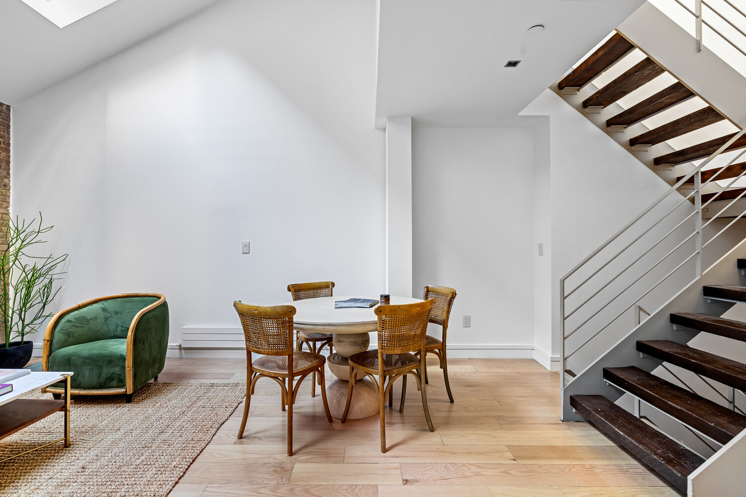 232 Adelphi Street, Unit 4 Brooklyn, NY 11205 - Photo 3 of 15 a view of a livingroom with furniture and wooden floor