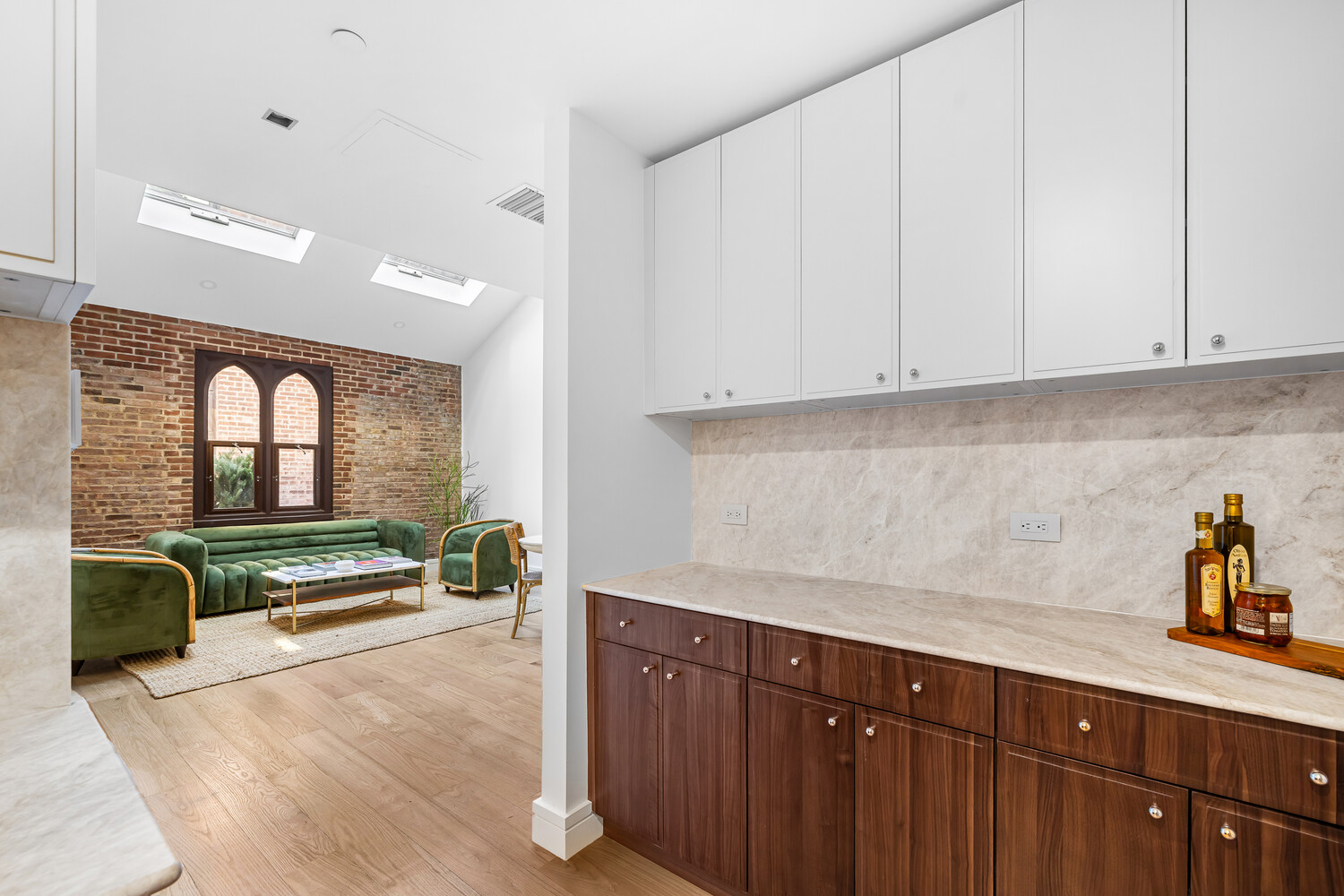 232 Adelphi Street, Unit 4 Brooklyn, NY 11205 - Photo 5 of 15 a kitchen with a refrigerator and white cabinets
