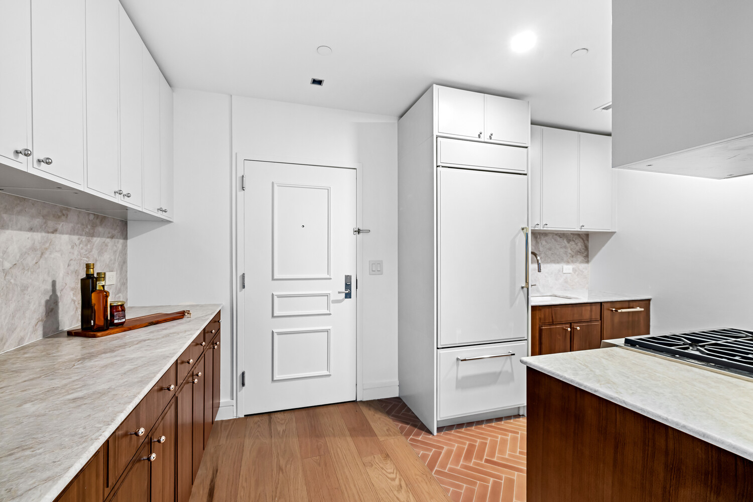 232 Adelphi Street, Unit 4 Brooklyn, NY 11205 - Photo 7 of 15 a kitchen with a refrigerator a stove top oven and wooden floor