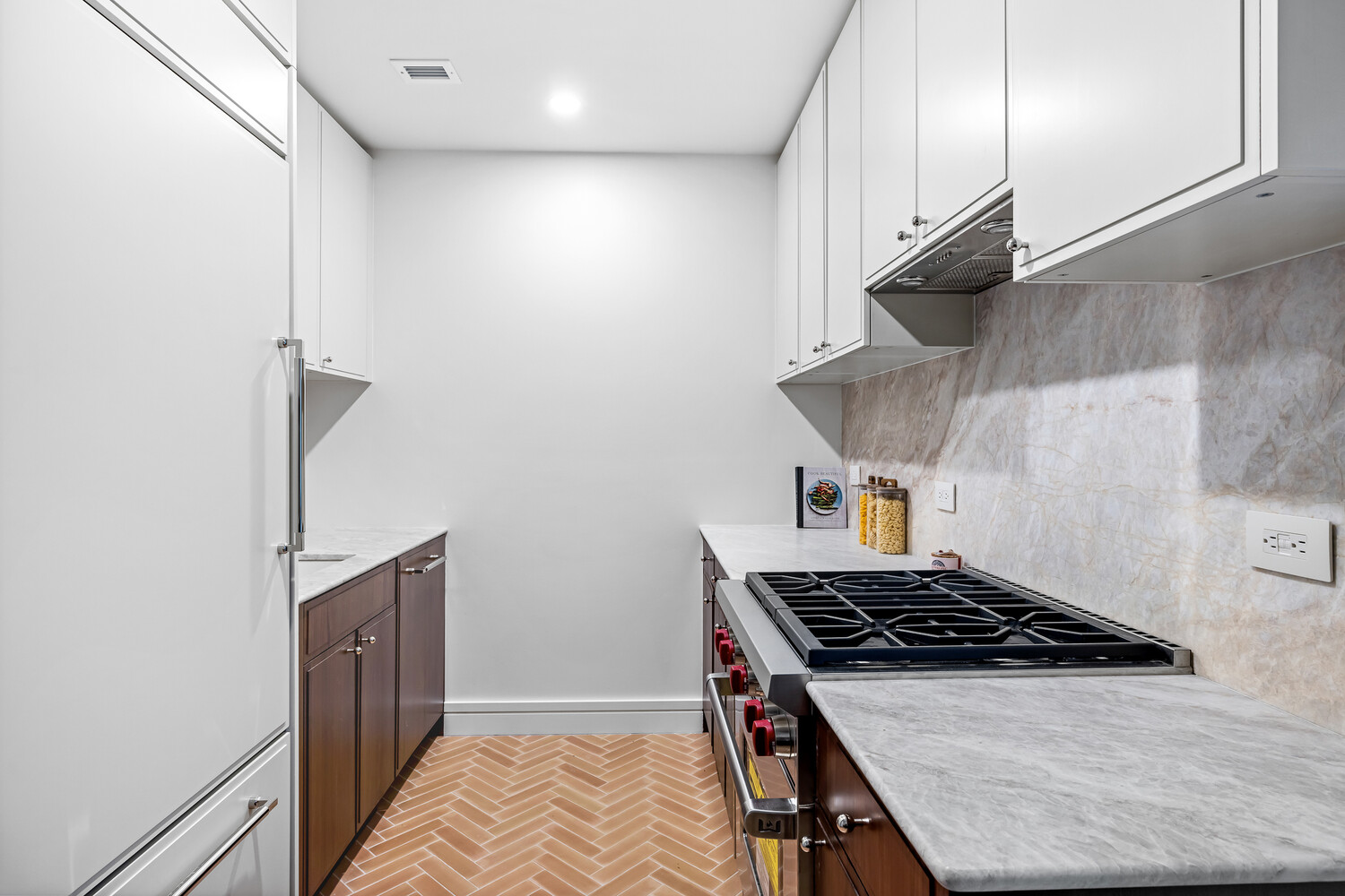 232 Adelphi Street, Unit 4 Brooklyn, NY 11205 - Photo 8 of 15 a kitchen with granite countertop a stove and a refrigerator