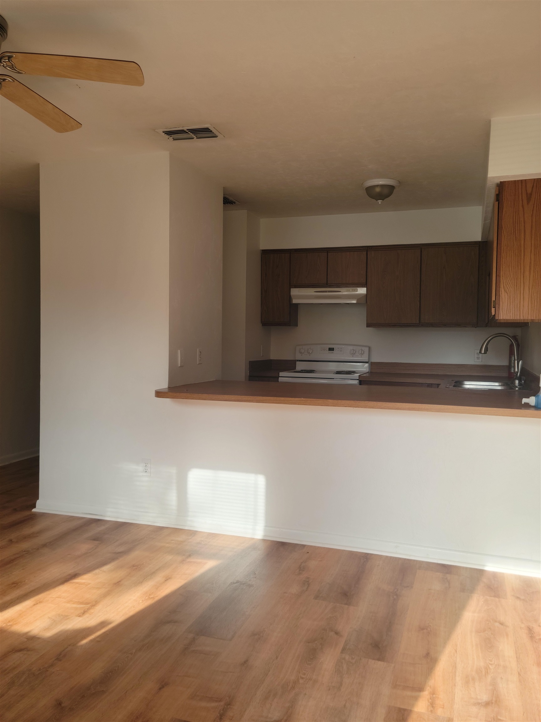 2605 Dobbs Road, Unit D St. Augustine, FL 32086 - Photo 2 of 13 a view of kitchen with stainless steel appliances granite countertop a sink and a stove