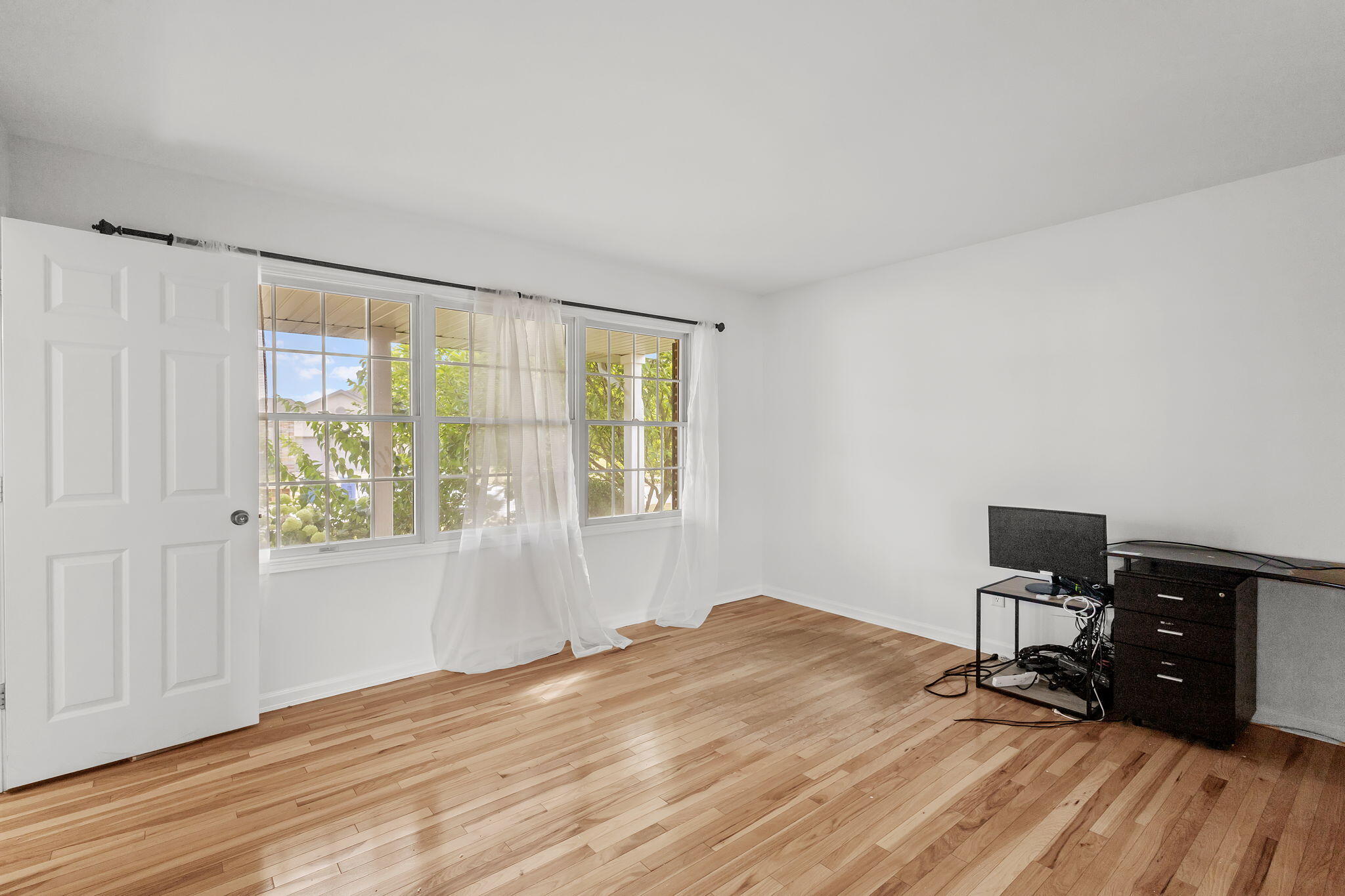 1741 East 106th Place Crown Point, IN 46307 - Photo 11 of 34 a view of a workspace with furniture and a window