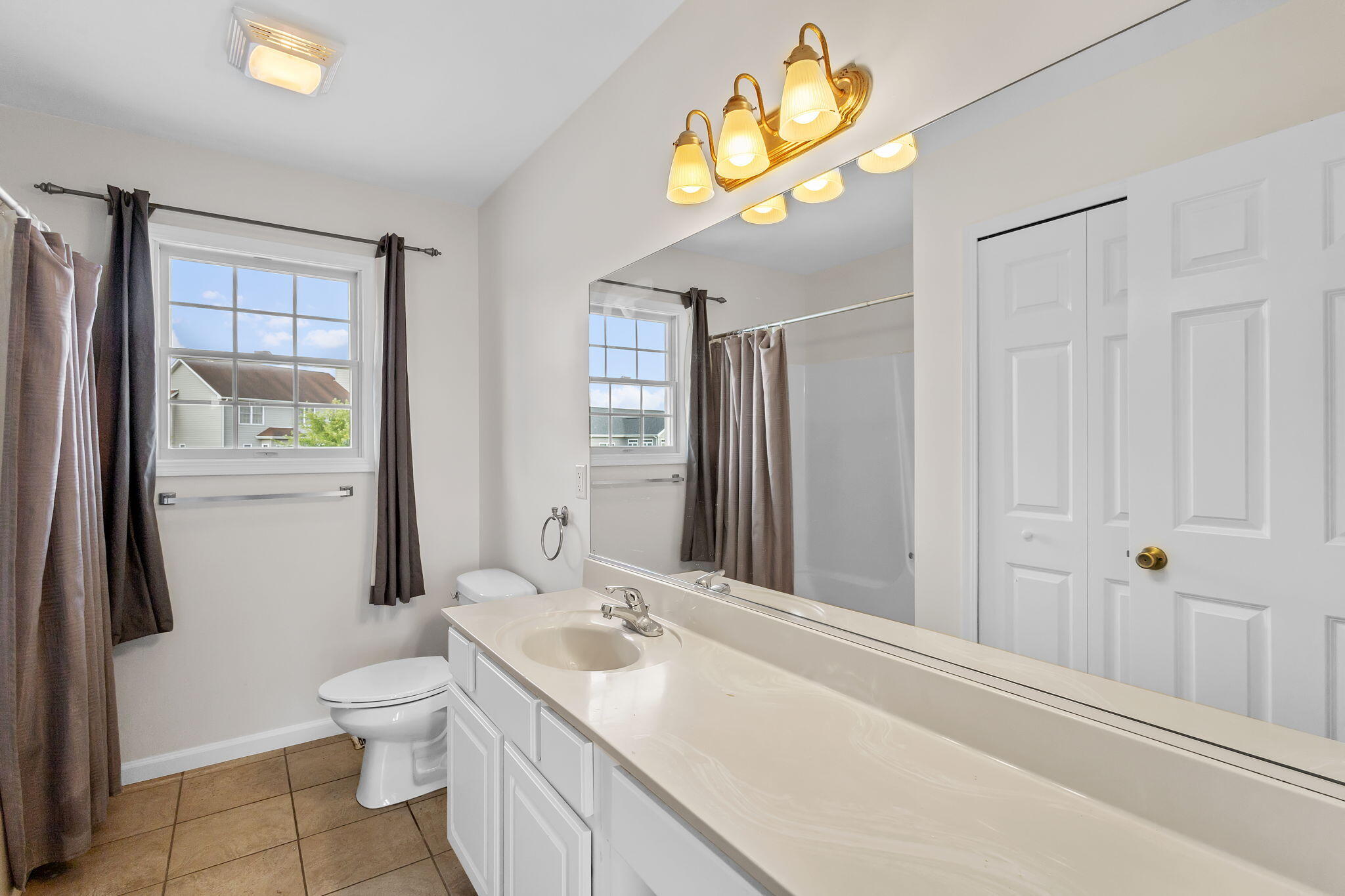 1741 East 106th Place Crown Point, IN 46307 - Photo 20 of 34 a bathroom with a sink a toilet and shower