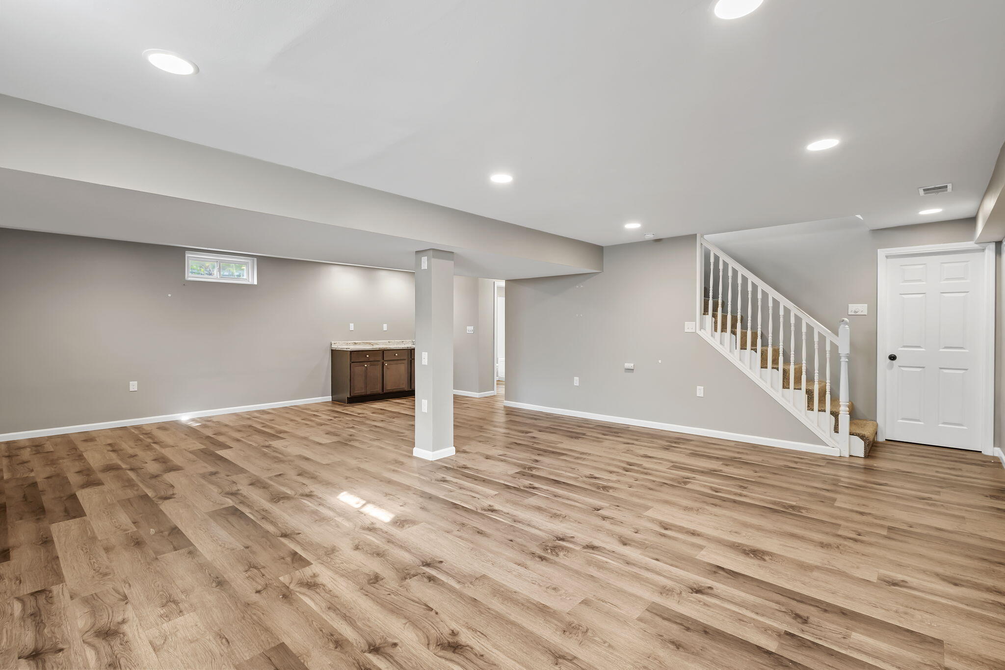 1741 East 106th Place Crown Point, IN 46307 - Photo 26 of 34 a view of an empty room with wooden floor and staircase