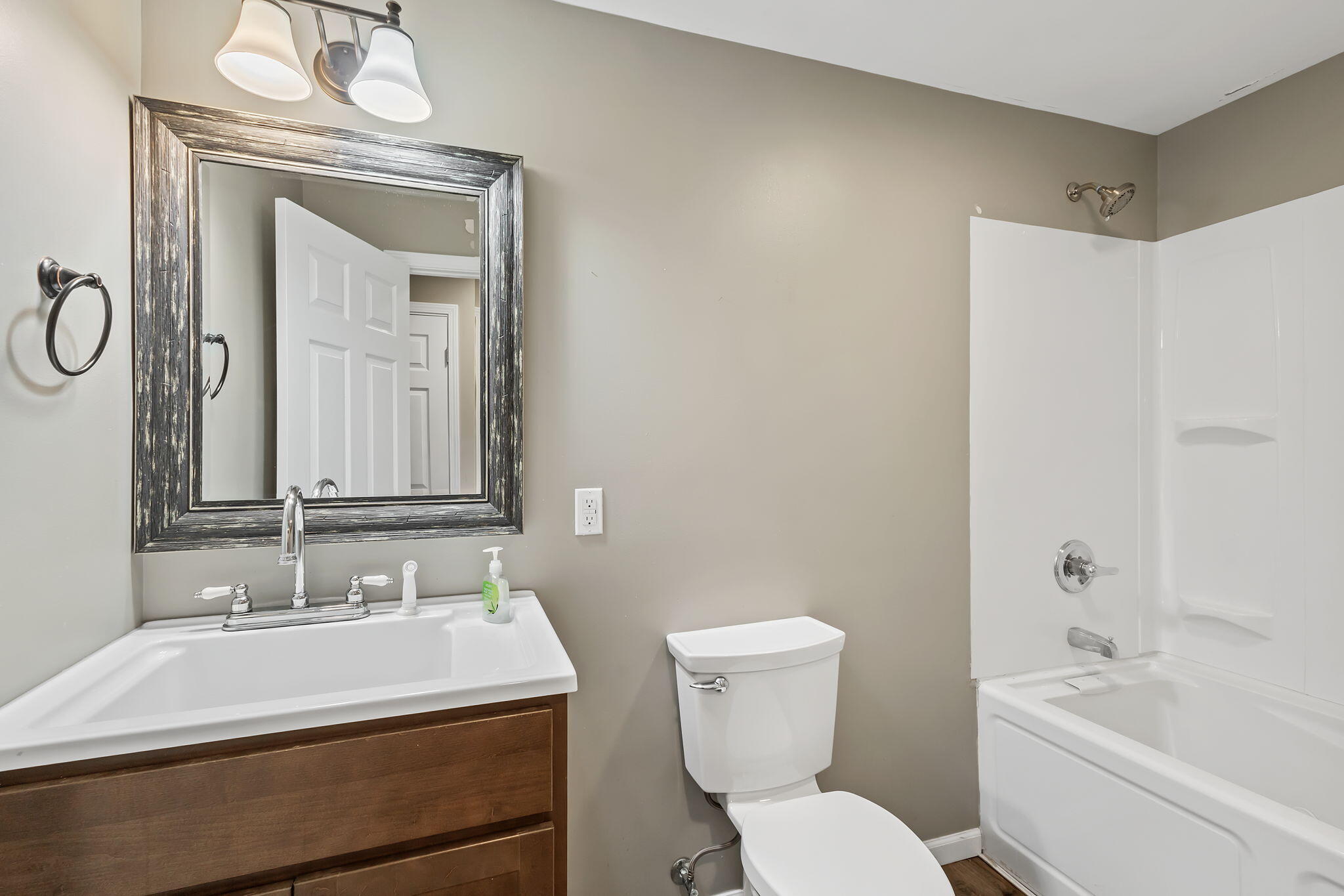 1741 East 106th Place Crown Point, IN 46307 - Photo 28 of 34 a bathroom with a sink a toilet and shower