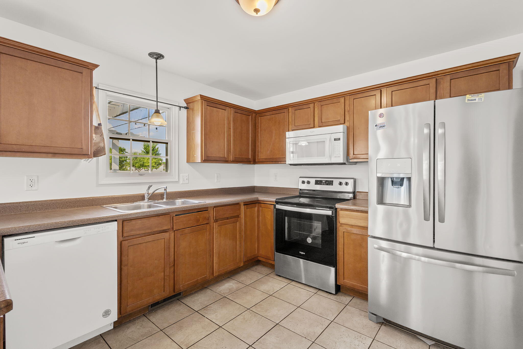 1741 East 106th Place Crown Point, IN 46307 - Photo 4 of 34 a kitchen with stainless steel appliances granite countertop a refrigerator sink and cabinets