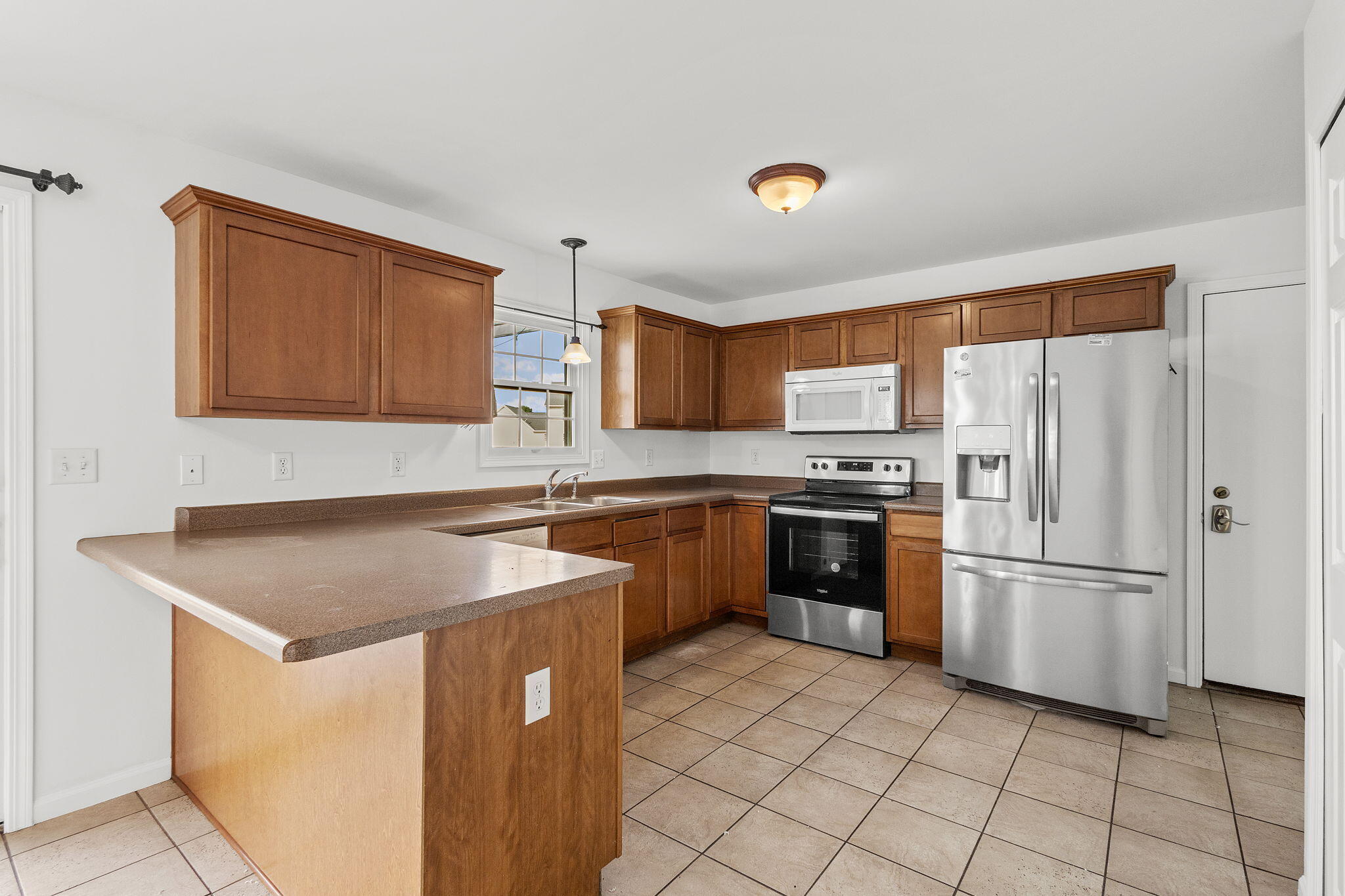 1741 East 106th Place Crown Point, IN 46307 - Photo 6 of 34 a kitchen with stainless steel appliances granite countertop a refrigerator sink and cabinets