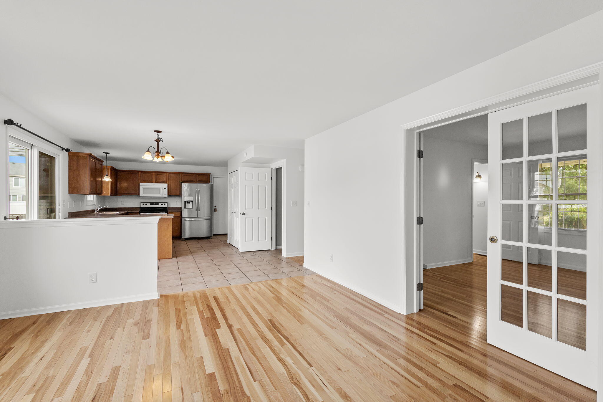 1741 East 106th Place Crown Point, IN 46307 - Photo 10 of 34 a view of a kitchen with wooden floor and a sink