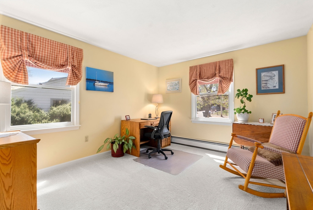 9 Davis Road Hudson, MA 01749 - Photo 16 of 32 a view of a workspace with furniture and a window