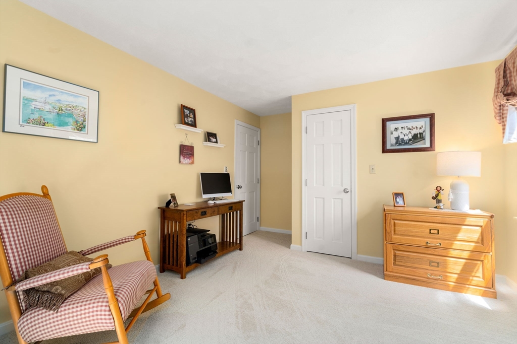9 Davis Road Hudson, MA 01749 - Photo 17 of 32 a view of a bedroom with workspace and a window