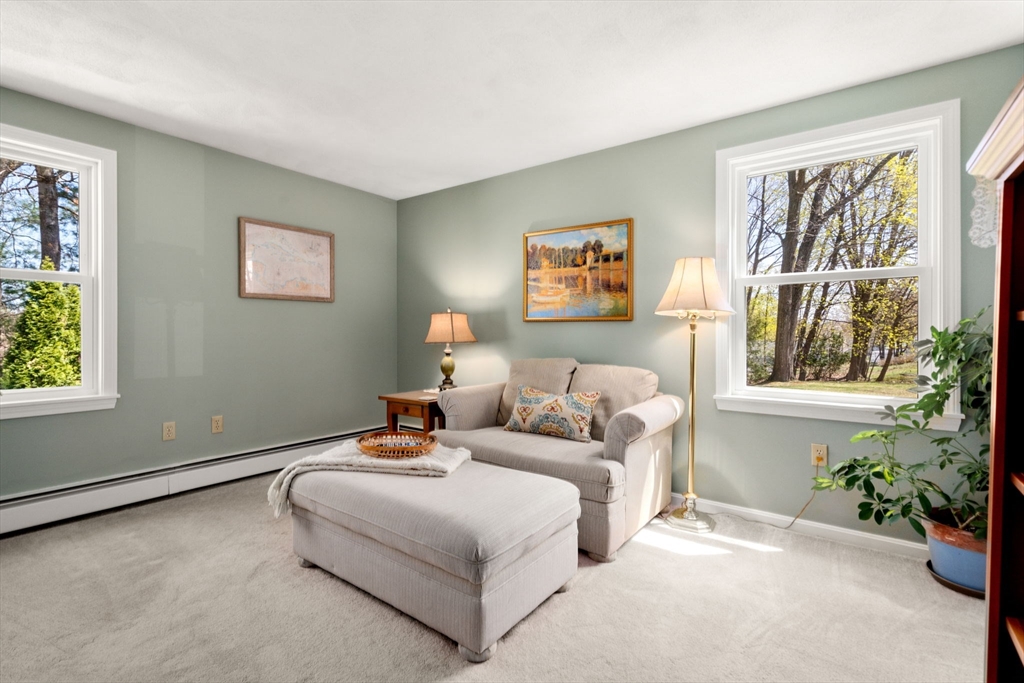 9 Davis Road Hudson, MA 01749 - Photo 18 of 32 a living room with furniture and a potted plant