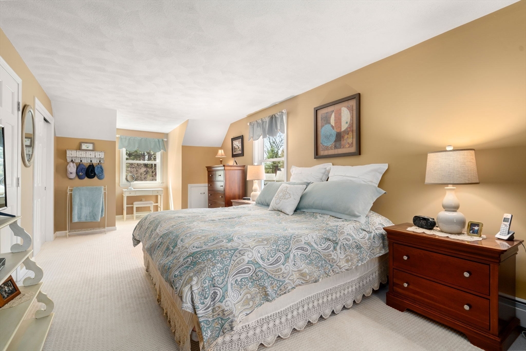 9 Davis Road Hudson, MA 01749 - Photo 24 of 32 a bedroom with a bed and night stand