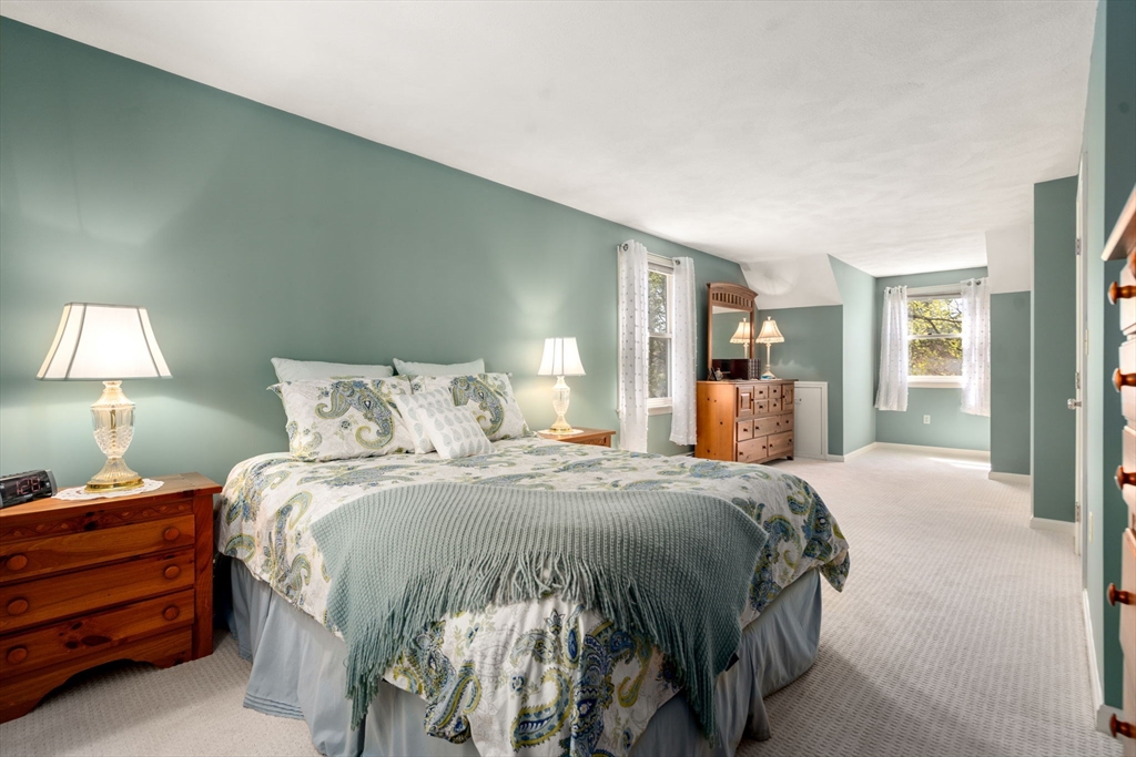 9 Davis Road Hudson, MA 01749 - Photo 26 of 32 a bedroom with a bed and a lamp