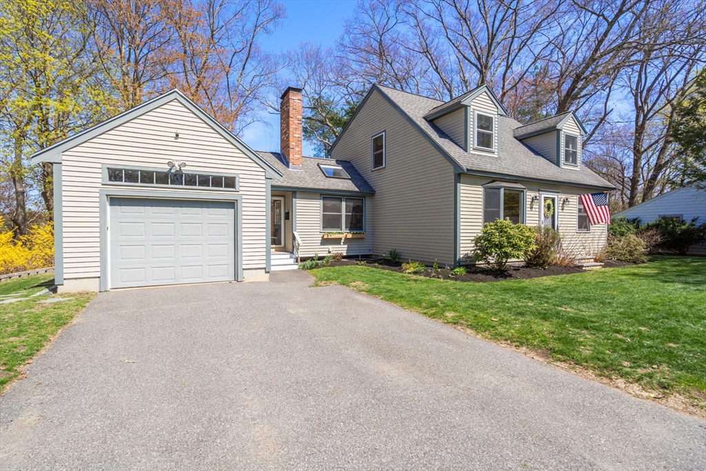 9 Davis Road Hudson, MA 01749 - Photo 3 of 32 a front view of a house with garden