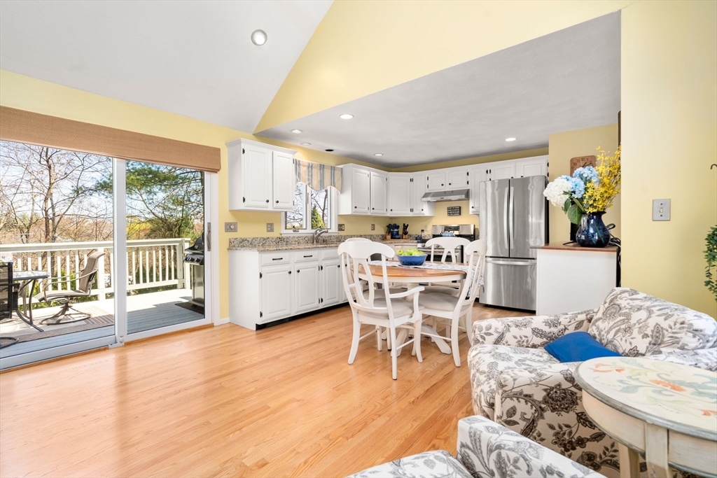 9 Davis Road Hudson, MA 01749 - Photo 9 of 32 a living room with stainless steel appliances furniture and a large window