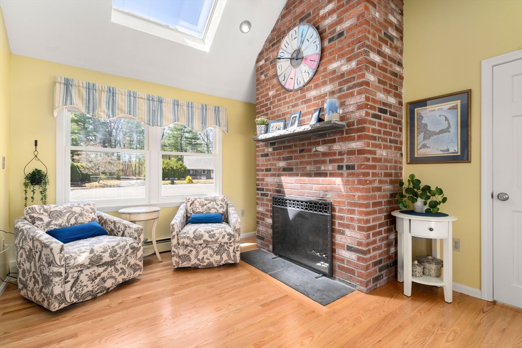 9 Davis Road Hudson, MA 01749 - Photo 10 of 32 a living room with furniture and a fireplace