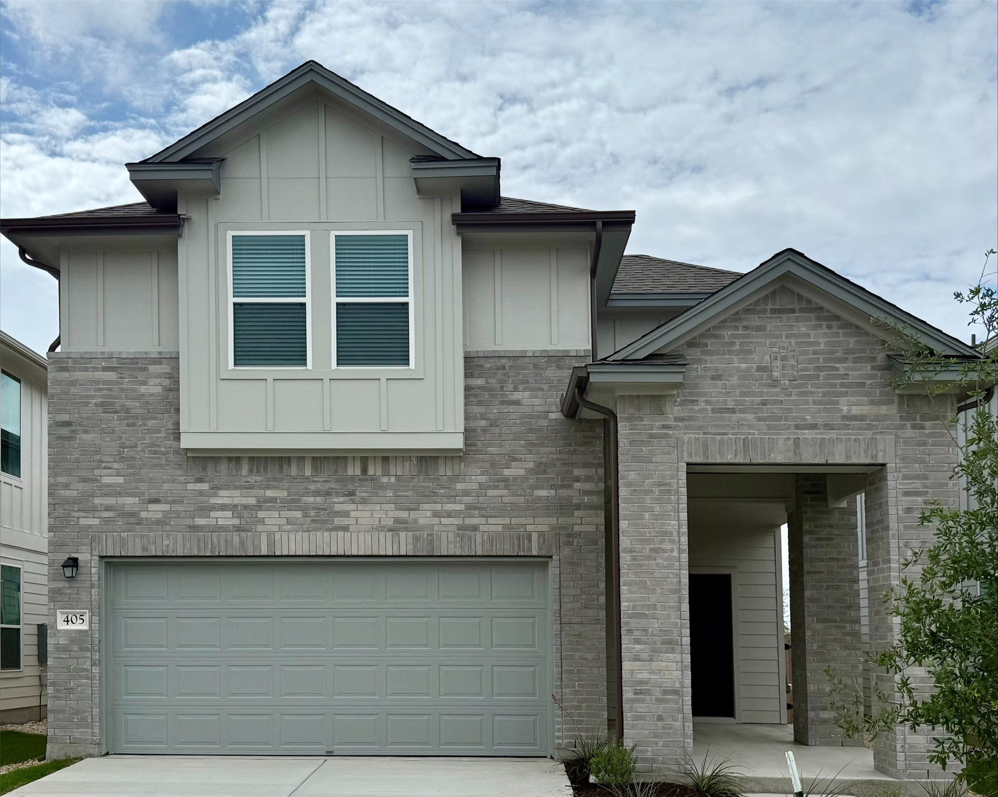 405 Young Street Buda, TX 78610 - Photo 1 of 25 a front view of a house with a yard