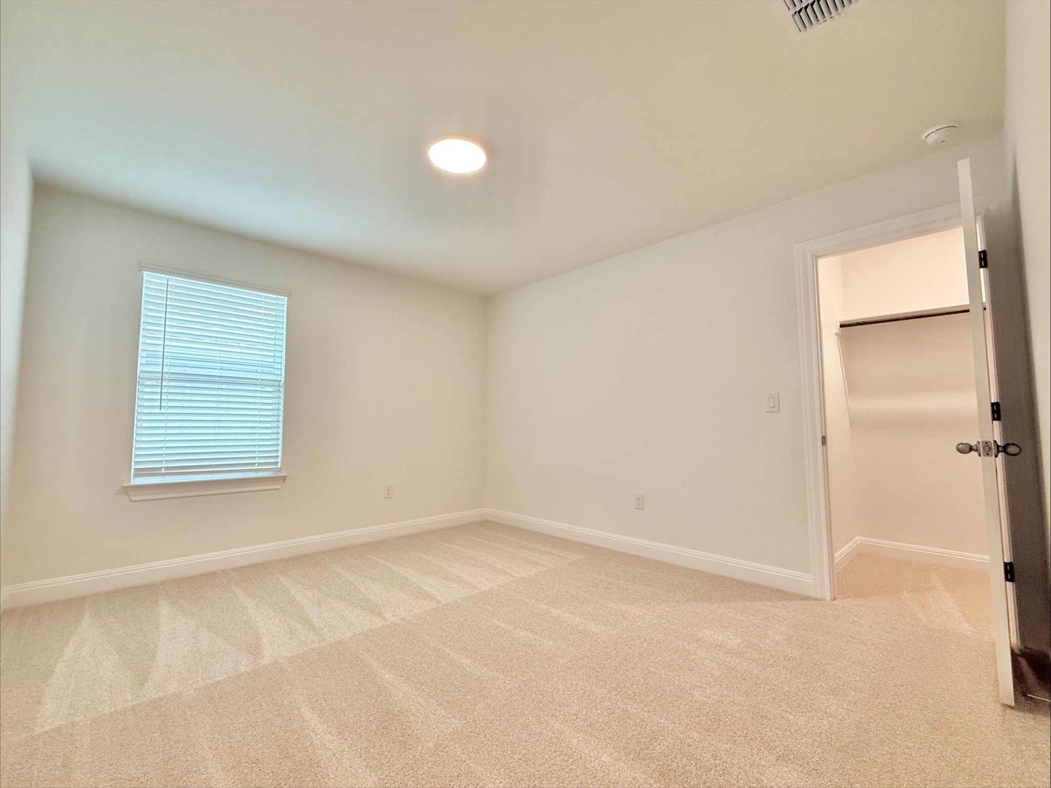 405 Young Street Buda, TX 78610 - Photo 16 of 25 an empty room with windows