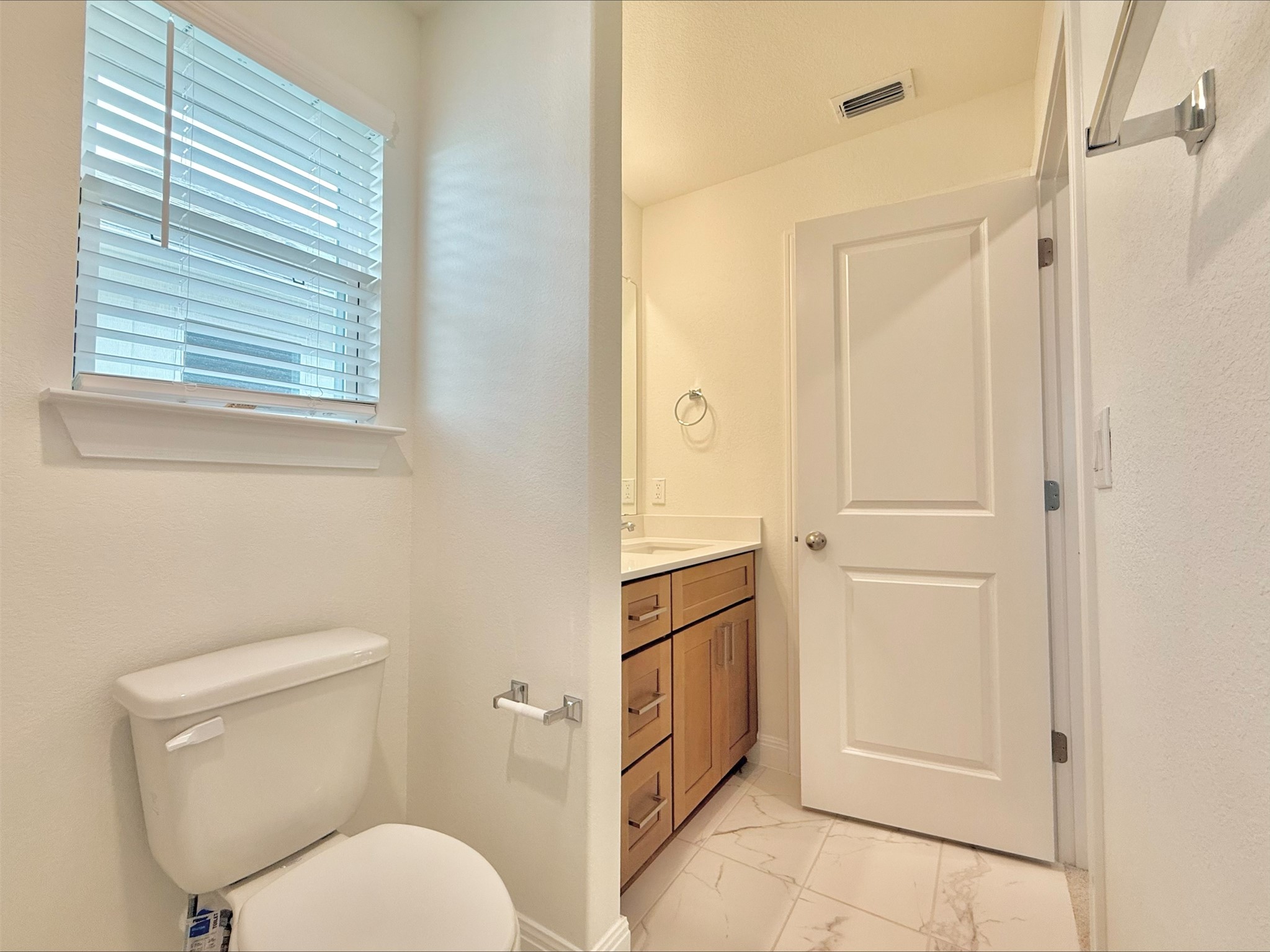 405 Young Street Buda, TX 78610 - Photo 17 of 25 a bathroom with a toilet sink and tub