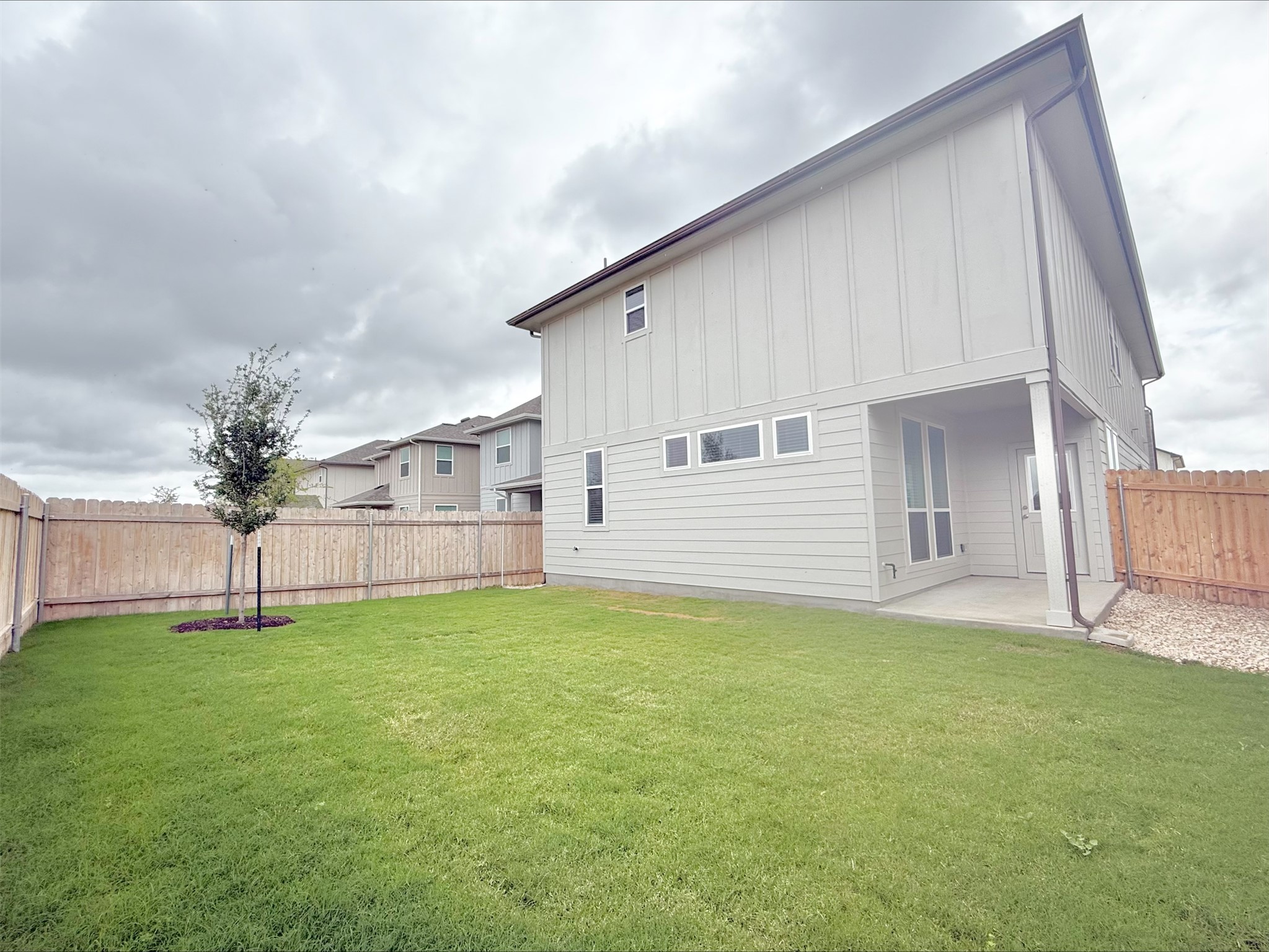 405 Young Street Buda, TX 78610 - Photo 21 of 25 a view of a backyard of a house