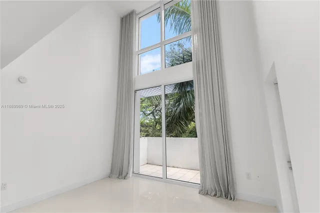 a view of a window in an empty room