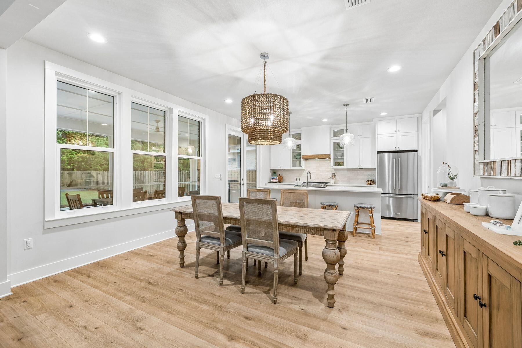 39 West Captain Fritz Way Freeport, FL 32439 - Photo 6 of 33 a view of a dining room with furniture window and wooden floor