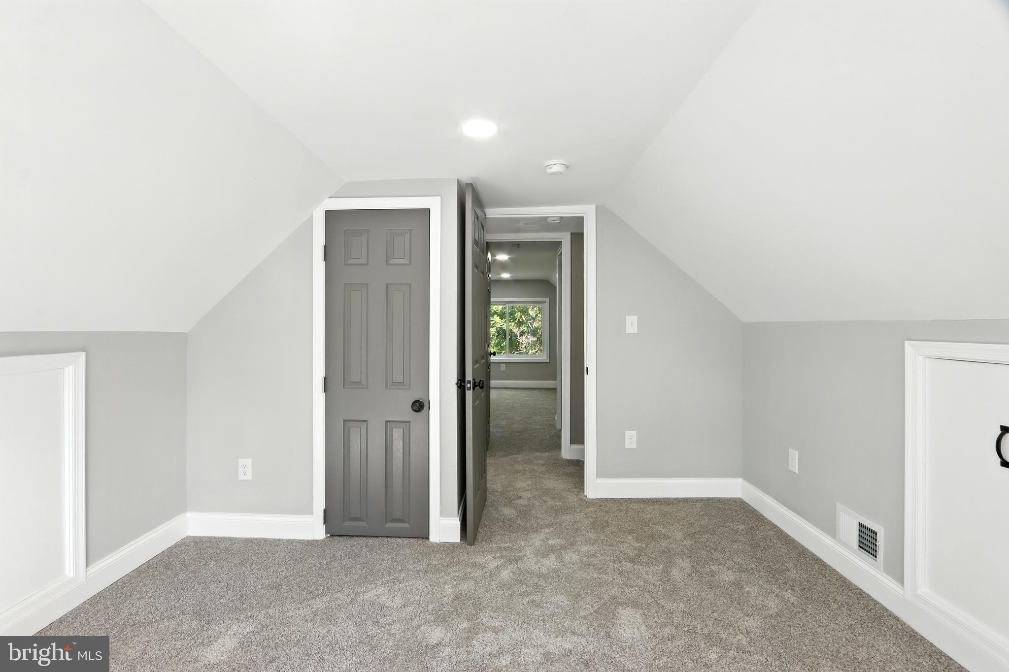 310 Audrey Avenue Baltimore, MD 21225 - Photo 14 of 35 an empty room with closet and mirror