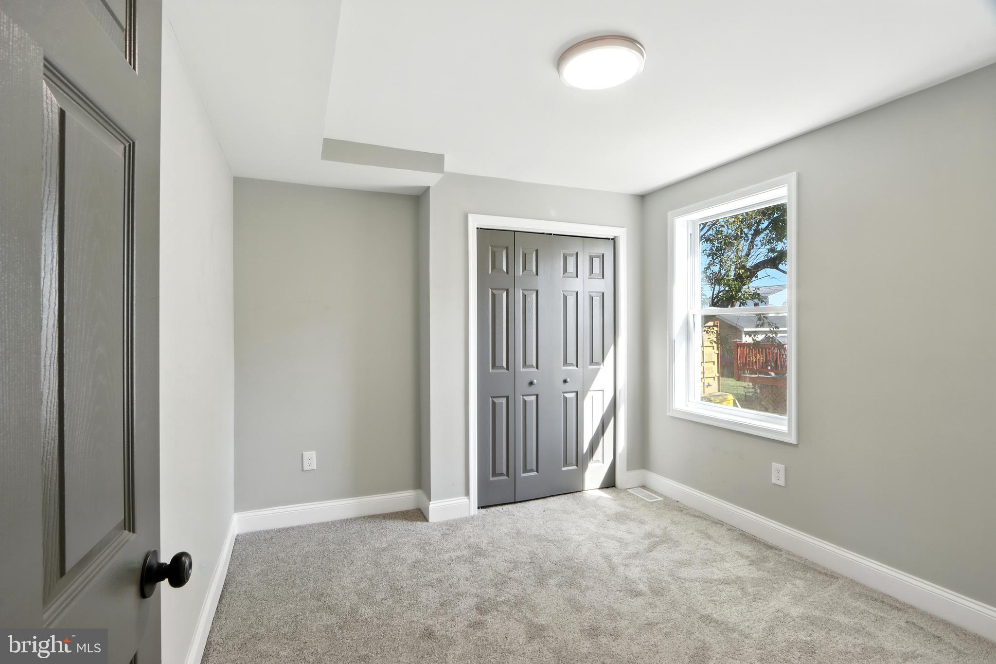 310 Audrey Avenue Baltimore, MD 21225 - Photo 22 of 35 an empty room with windows