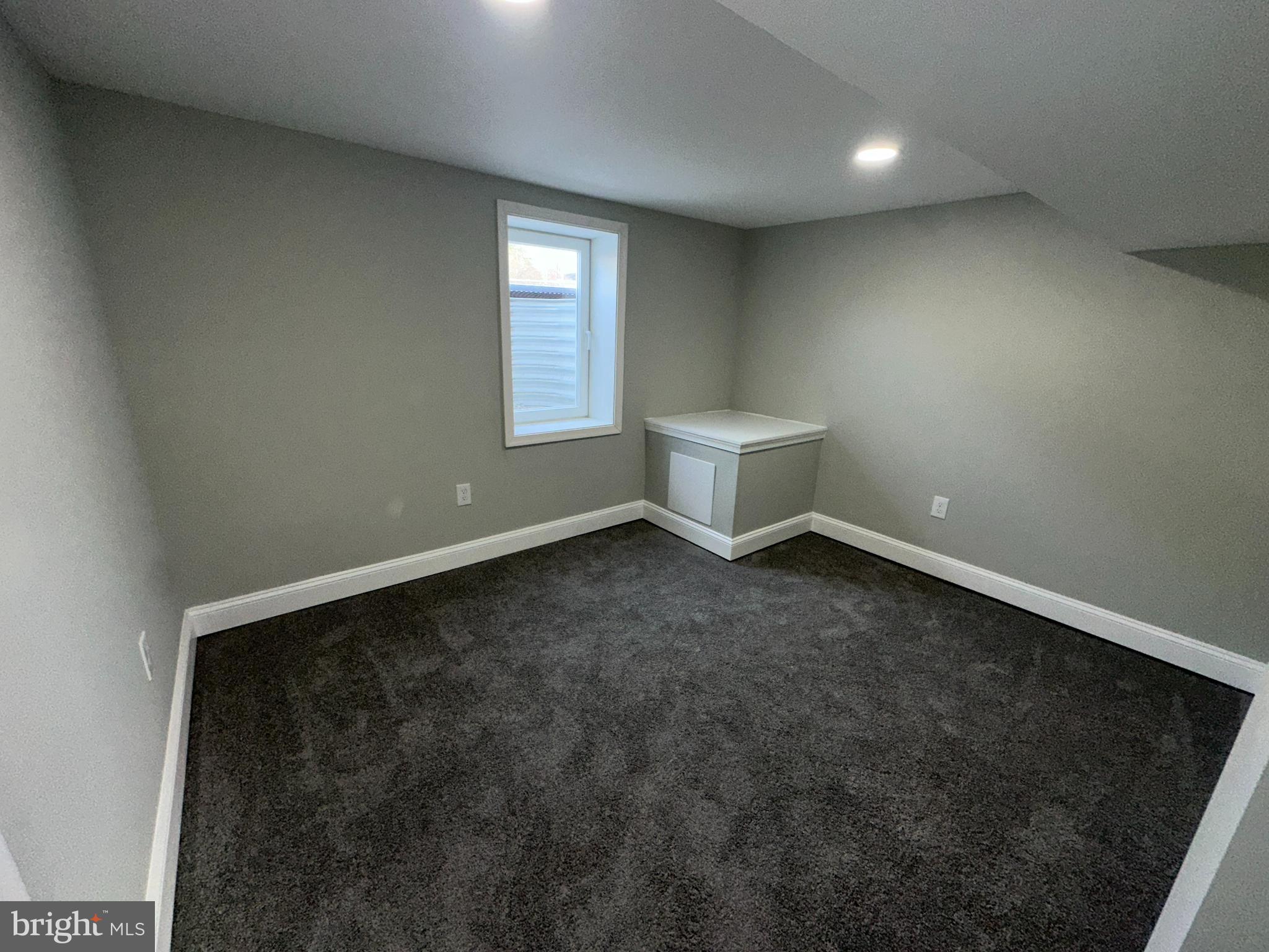 310 Audrey Avenue Baltimore, MD 21225 - Photo 24 of 35 an empty room with windows