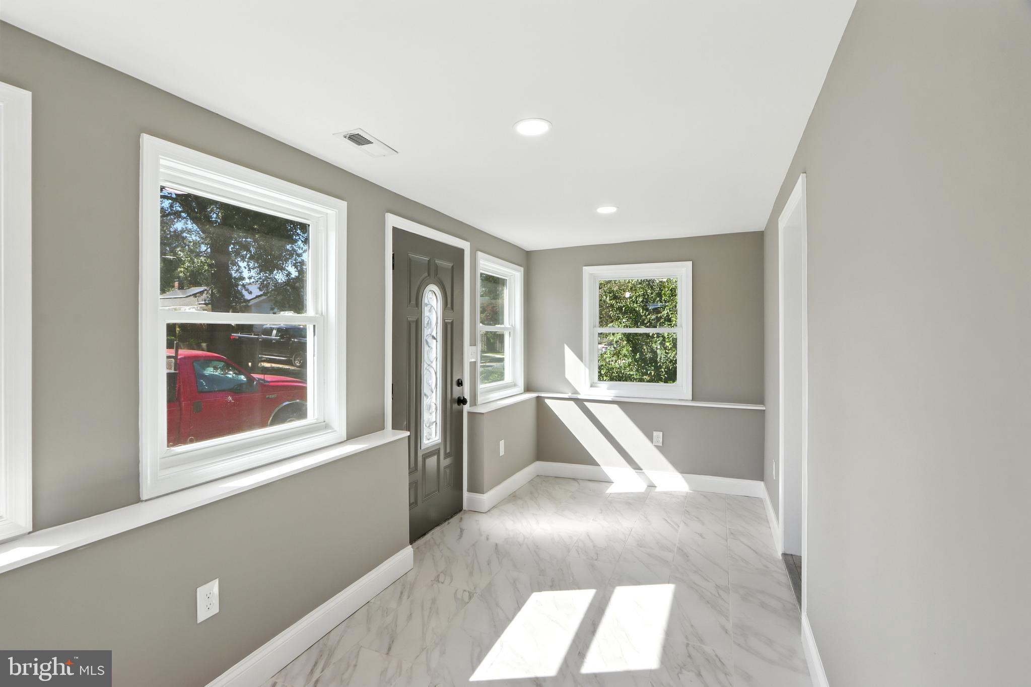 310 Audrey Avenue Baltimore, MD 21225 - Photo 3 of 35 a picture of a living room with a large window
