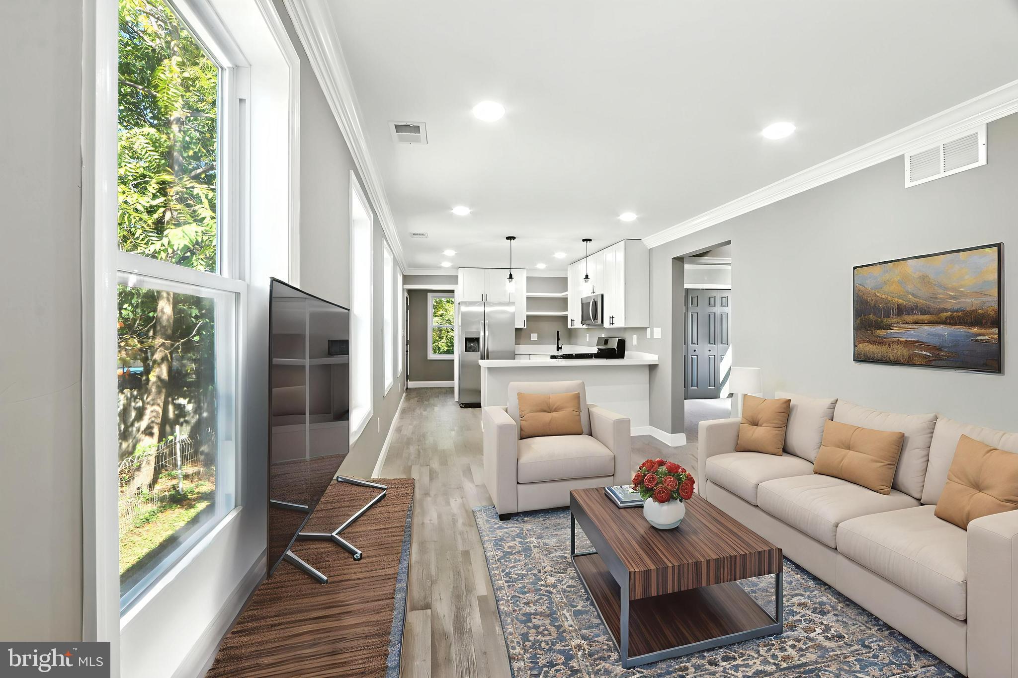 310 Audrey Avenue Baltimore, MD 21225 - Photo 5 of 35 a living room with furniture and a large window