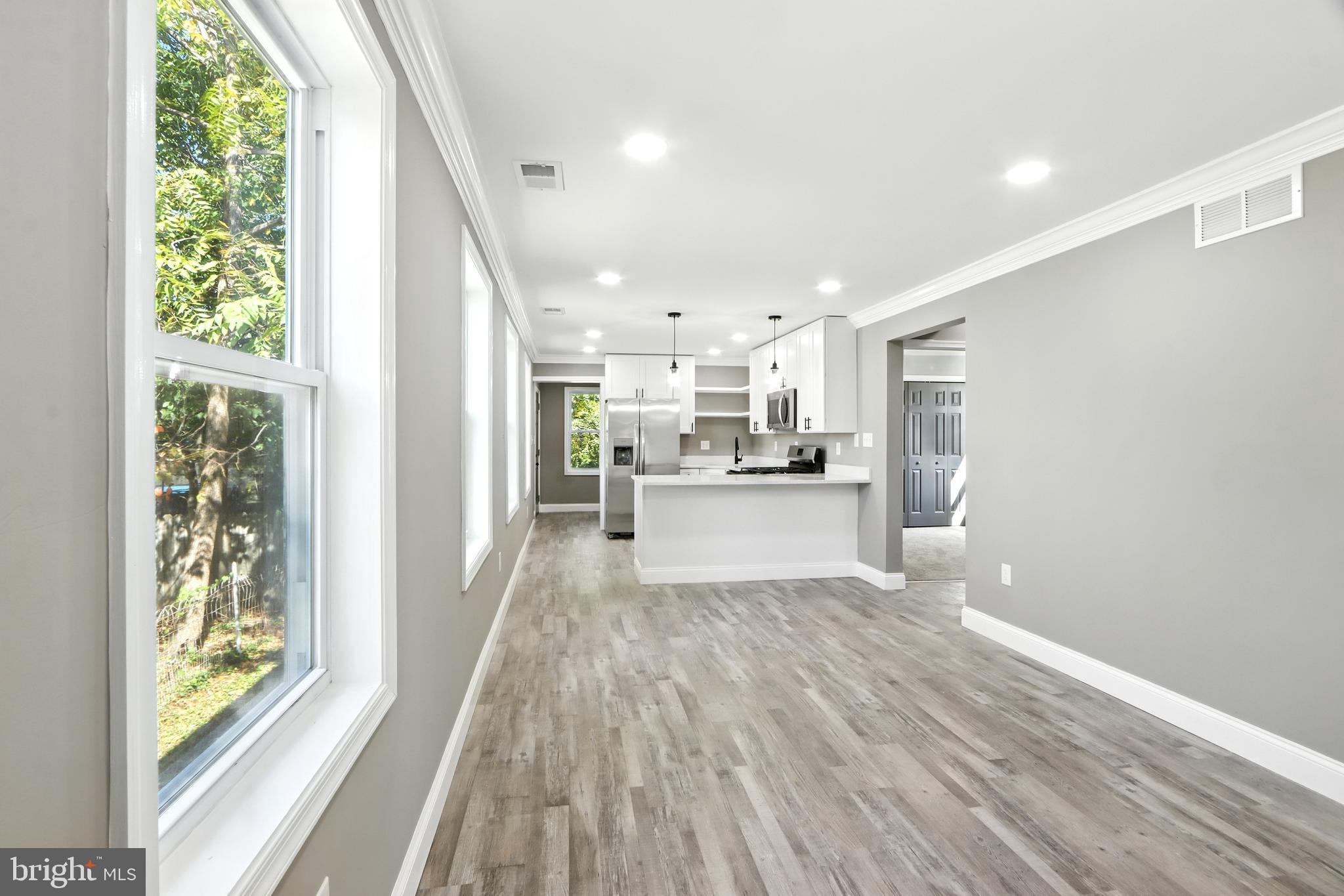 310 Audrey Avenue Baltimore, MD 21225 - Photo 7 of 35 a view of kitchen with wooden floor and electronic appliances