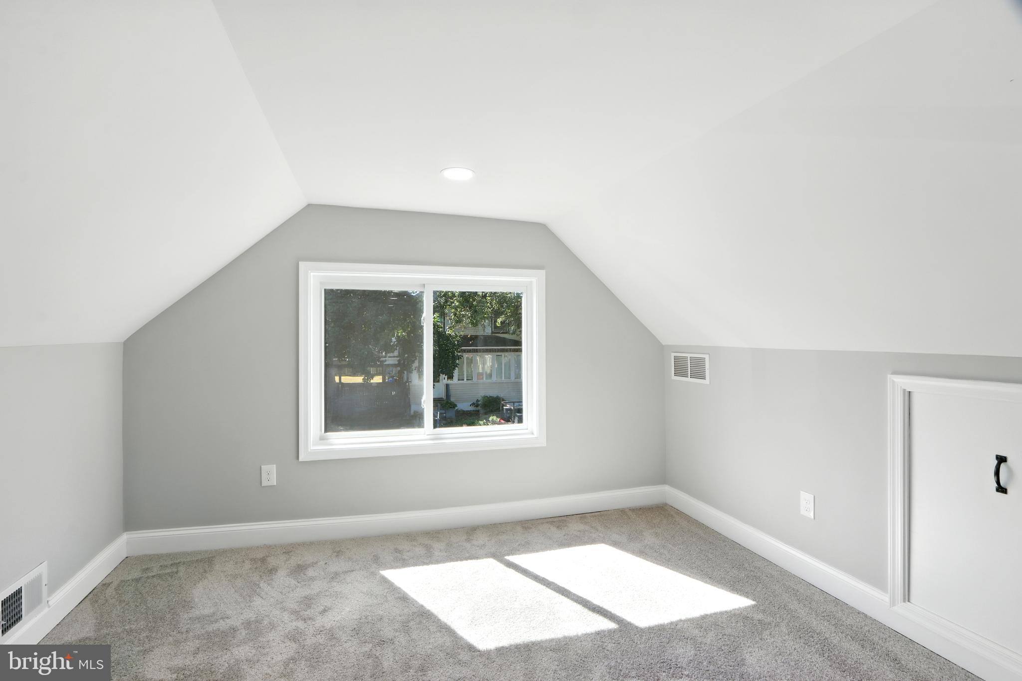 310 Audrey Avenue Baltimore, MD 21225 - Photo 9 of 35 an empty room with a window