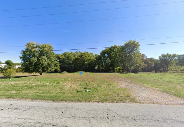 a view of a yard with an trees