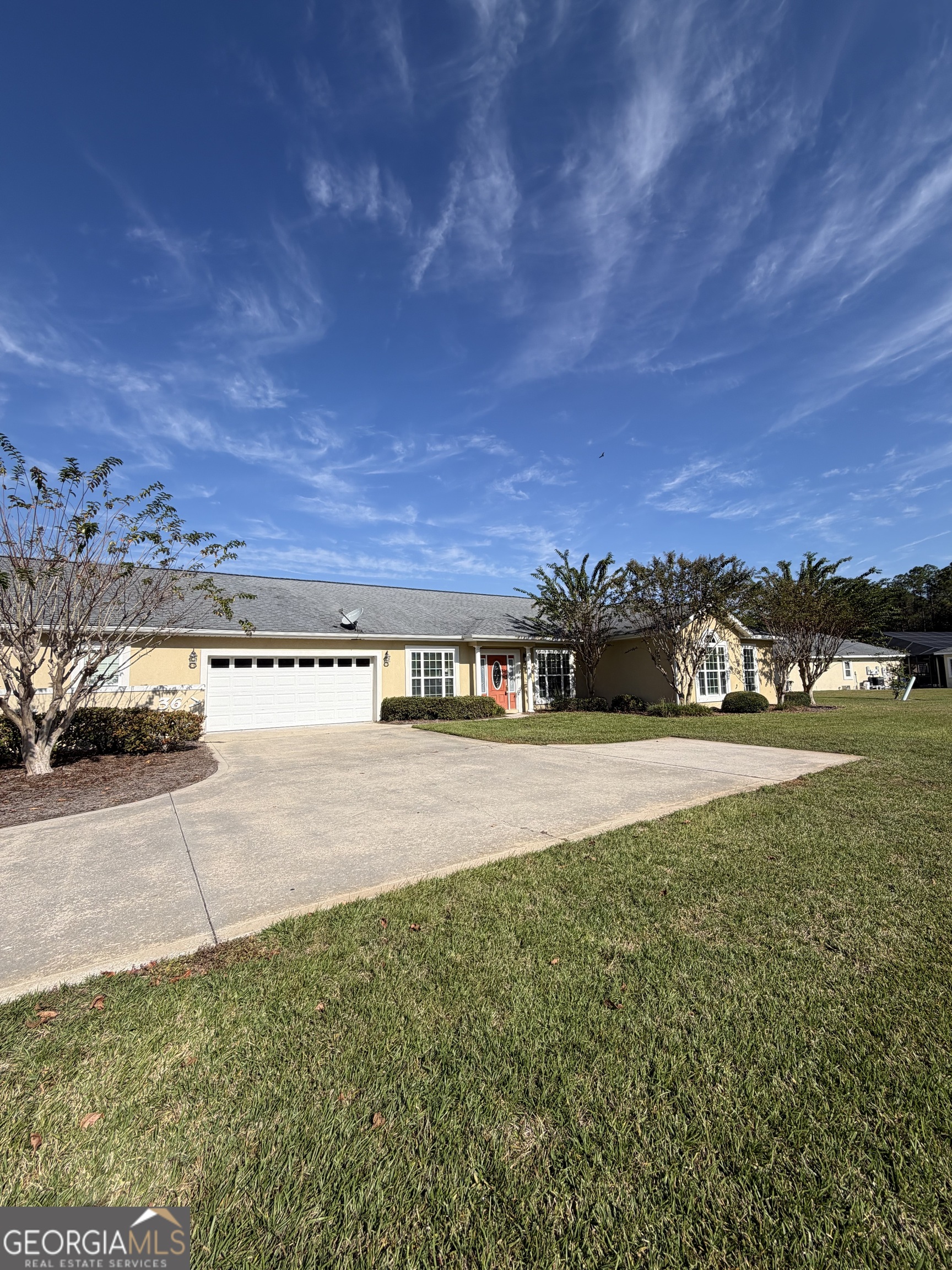 36 Coastal Walk St. Marys, GA 31558 - Photo 1 of 40 a view of a swimming pool with an outdoor seating