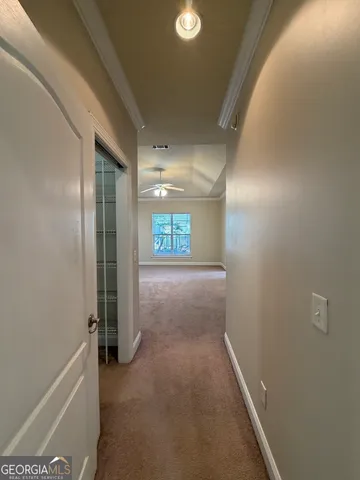 a view of hallway with livingroom