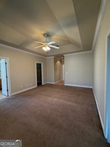 a view of an empty room with a chandelier
