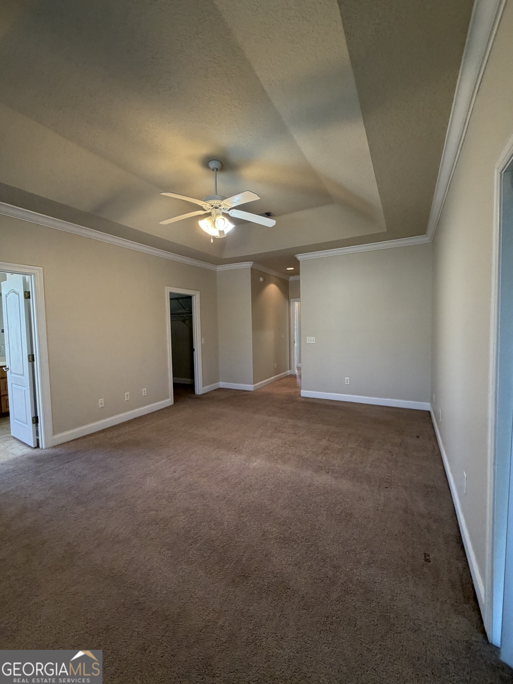 36 Coastal Walk St. Marys, GA 31558 - Photo 16 of 40 a view of an empty room with a chandelier