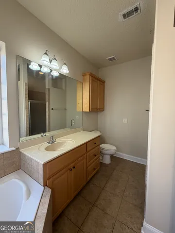 a bathroom with a sink double vanity and a mirror