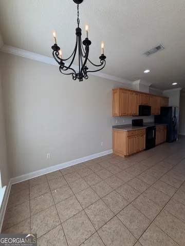 a view of a kitchen with a sink stainless steel appliances and cabinets