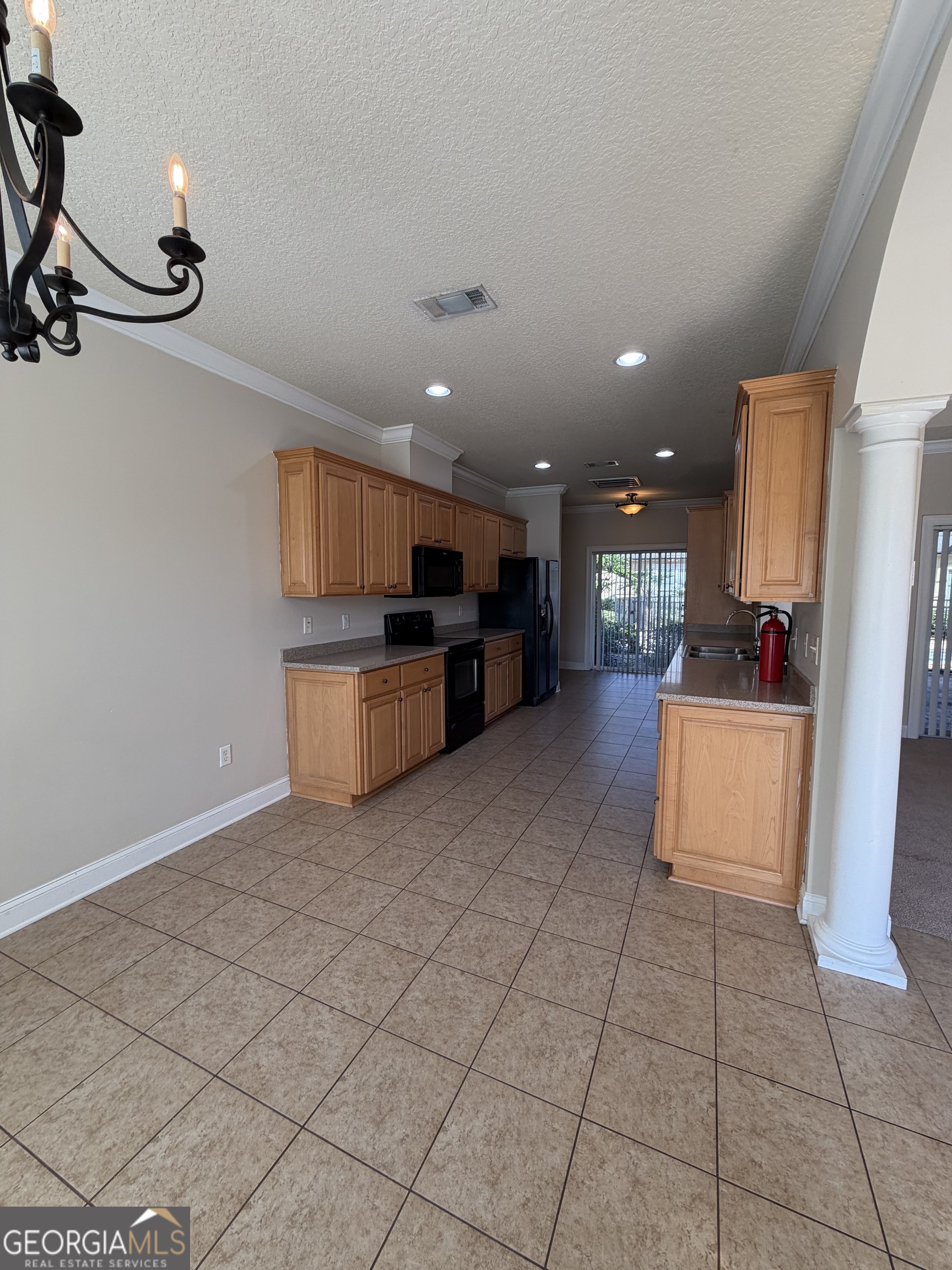 36 Coastal Walk St. Marys, GA 31558 - Photo 28 of 40 a kitchen with stainless steel appliances granite countertop a refrigerator and a stove top oven