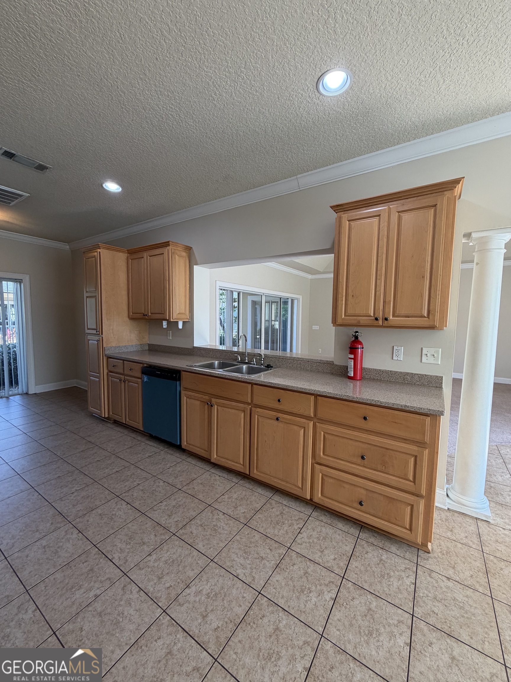 36 Coastal Walk St. Marys, GA 31558 - Photo 33 of 40 a kitchen with granite countertop a sink cabinets and stainless steel appliances