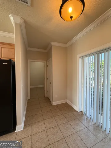 a view of a livingroom with wooden floor and a window